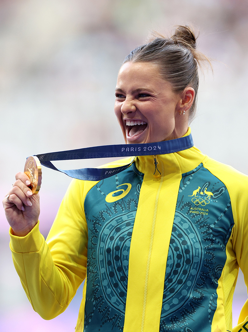 Nina Kennedy celebrating with her Gold Medal at the Paris Olympics